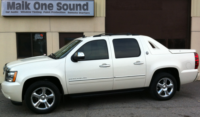 2012 Chevrolet Avalanche with professional window tint in North Bay